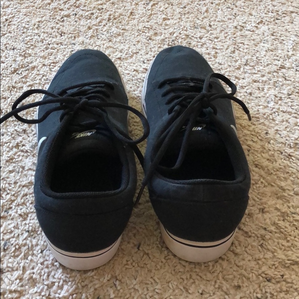 Men black and white Nike shoes